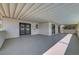 Large, covered patio area featuring white siding and multiple access points at 4807 Sacks Dr, Las Vegas, NV 89122
