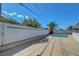 Backyard pool area with adjacent palm tree and concrete perimeter at 4807 Sacks Dr, Las Vegas, NV 89122