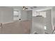 Bright bonus room with neutral carpet, a ceiling fan, and built-in storage at 4833 Royal Magnolia St, North Las Vegas, NV 89031