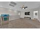 Large open bonus room with a ceiling fan and access to a bathroom at 4833 Royal Magnolia St, North Las Vegas, NV 89031