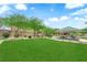 Community park with green grass, picnic tables and trees at 4833 Royal Magnolia St, North Las Vegas, NV 89031