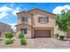 Beautiful two-story home with a well-maintained lawn and a spacious two-car garage at 4833 Royal Magnolia St, North Las Vegas, NV 89031