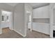 Hallway area features a bathroom and built-in storage, great for linens and other items at 4833 Royal Magnolia St, North Las Vegas, NV 89031