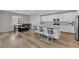 A well-lit kitchen with granite countertops, stainless steel appliances, and barstool seating at 4833 Royal Magnolia St, North Las Vegas, NV 89031