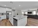 Spacious kitchen featuring an island with granite counters and stainless appliances at 4833 Royal Magnolia St, North Las Vegas, NV 89031
