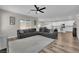 Spacious living room area featuring hardwood floors and a comfortable couch at 4833 Royal Magnolia St, North Las Vegas, NV 89031