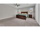 The main bedroom is spacious with a ceiling fan, carpet, and two side windows at 4833 Royal Magnolia St, North Las Vegas, NV 89031