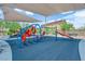 Community playground with slides, swings, and padded flooring for  at 4833 Royal Magnolia St, North Las Vegas, NV 89031