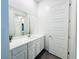 Bathroom boasts modern vanity, a large mirror, and a bright aesthetic at 49 Charlotte Ridge Pl, Henderson, NV 89011