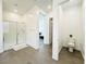 Bright bathroom features glass shower door, tile floors, and modern fixtures at 49 Charlotte Ridge Pl, Henderson, NV 89011