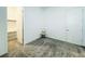 Bedroom with open walk-in closet, carpeted floors, and natural light at 49 Charlotte Ridge Pl, Henderson, NV 89011