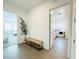 Hallway with view into laundry room, light hard flooring and modern plant at 49 Charlotte Ridge Pl, Henderson, NV 89011