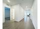 Hallway view features tile floors and access to multiple rooms at 49 Charlotte Ridge Pl, Henderson, NV 89011