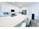 Modern kitchen featuring a large center island with seating and stainless steel appliances at 49 Charlotte Ridge Pl, Henderson, NV 89011