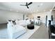 Open-concept living area featuring modern decor, ample lighting, and tile floors at 49 Charlotte Ridge Pl, Henderson, NV 89011