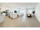 Spacious living area with dining and kitchen featuring open concept floor plan and tile floors at 49 Charlotte Ridge Pl, Henderson, NV 89011