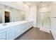 Modern main bathroom with double vanity, walk-in shower, and ample counter space at 49 Charlotte Ridge Pl, Henderson, NV 89011