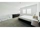Bright main bedroom with carpet, windows, and ample space for furniture at 49 Charlotte Ridge Pl, Henderson, NV 89011
