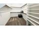 Spacious walk-in closet with shelving and carpet, ready for organization at 49 Charlotte Ridge Pl, Henderson, NV 89011