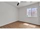 This bedroom has hard surface floors, a window, and a ceiling fan at 4911 Ranchodomingo Ct, North Las Vegas, NV 89031