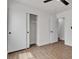This bedroom features hard surface floors, a closet, and a neutral color scheme at 4911 Ranchodomingo Ct, North Las Vegas, NV 89031