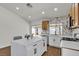 Bright kitchen with marble counters, stainless appliances, an island, and glass doors to the outside at 4911 Ranchodomingo Ct, North Las Vegas, NV 89031