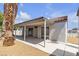 The exterior features include a covered patio with plenty of space for relaxing and entertaining at 4911 Ranchodomingo Ct, North Las Vegas, NV 89031
