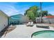 Backyard featuring a pool, jacuzzi, lounge chairs, and an outdoor seating area, creating a perfect outdoor oasis at 5008 Donnie Ave, Las Vegas, NV 89130