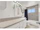 Charming bathroom featuring a large mirror, white vanity, and decorative wall accents at 5008 Donnie Ave, Las Vegas, NV 89130