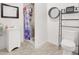 Compact bathroom featuring a tile shower, modern toilet, and clean, minimalist design for functionality at 5008 Donnie Ave, Las Vegas, NV 89130