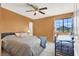 Bright bedroom features a ceiling fan, soft colors, and a comfortable bed setup at 5008 Donnie Ave, Las Vegas, NV 89130