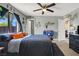 Comfortable bedroom featuring a queen bed, stylish decor, and bright window light at 5008 Donnie Ave, Las Vegas, NV 89130