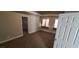 Spacious bedroom with neutral carpet, two windows, and an ensuite bathroom at 5008 Donnie Ave, Las Vegas, NV 89130