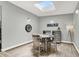 Dining room with plank flooring, skylight, table and chairs at 5008 Donnie Ave, Las Vegas, NV 89130