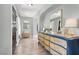 Light and bright entryway with plank flooring, decorative chest of drawers and neutral color palette at 5008 Donnie Ave, Las Vegas, NV 89130
