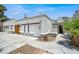 Exterior view of home with two-car garage, private entry, and mature landscaping at 5008 Donnie Ave, Las Vegas, NV 89130