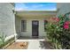 Close up view of the front door with glass panes and a small covered entry at 5008 Donnie Ave, Las Vegas, NV 89130