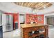 Bright kitchen featuring a butcher block island, stainless steel appliances, and a view of the backyard at 5008 Donnie Ave, Las Vegas, NV 89130