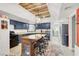 Charming kitchen with dark blue cabinets, a butcher block island, and a window overlooking the backyard at 5008 Donnie Ave, Las Vegas, NV 89130