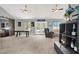 Spacious living room with ceiling fans, natural light, and barn door accent at 5008 Donnie Ave, Las Vegas, NV 89130