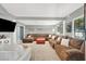 Spacious living room featuring a large sectional sofa, modern decor, and a bright, airy atmosphere at 5008 Donnie Ave, Las Vegas, NV 89130