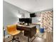 Inviting home office space with a modern desk setup, stylish chair, and a large monitor at 5008 Donnie Ave, Las Vegas, NV 89130