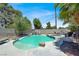 A refreshing swimming pool featuring a rock waterfall and a relaxing jacuzzi, creating a perfect backyard oasis at 5008 Donnie Ave, Las Vegas, NV 89130