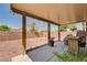 Outdoor patio with ample space, barbecue and easy to maintain gravel landscaping at 5220 Melbourne Ridge Ct, Las Vegas, NV 89141