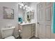Well-lit half bath with modern vanity, updated fixtures, and decorative accents at 5220 Melbourne Ridge Ct, Las Vegas, NV 89141