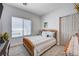 Cozy bedroom featuring natural light, carpet floors, and closet at 5220 Melbourne Ridge Ct, Las Vegas, NV 89141