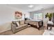 Bedroom with hardwood floors, sofa, and natural light at 5220 Melbourne Ridge Ct, Las Vegas, NV 89141