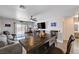 Living room featuring hardwood floors, sofa, and backyard access at 5220 Melbourne Ridge Ct, Las Vegas, NV 89141