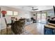 Open living area features bar seating, sliding glass doors, and modern decor at 5220 Melbourne Ridge Ct, Las Vegas, NV 89141