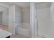 Bathroom featuring a separate shower stall, soaking tub, and door to another room at 5484 Mercury Springs Dr, Las Vegas, NV 89122